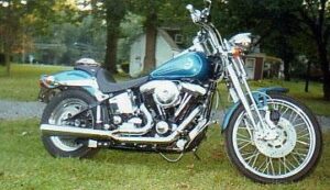 Side view of a blue 1994 Harley Springer Softail